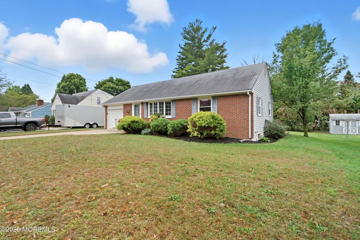 Attached, Backyard, Exterior, Facade, Brick Facade, Cape Cod