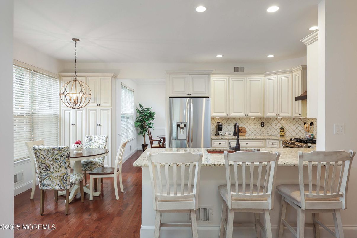 Chandelier, Dining room, Interior, Kitchen, Pendant Lights, Recessed Lighting, Stainless Steel Appliances, Wood Texture Flooring