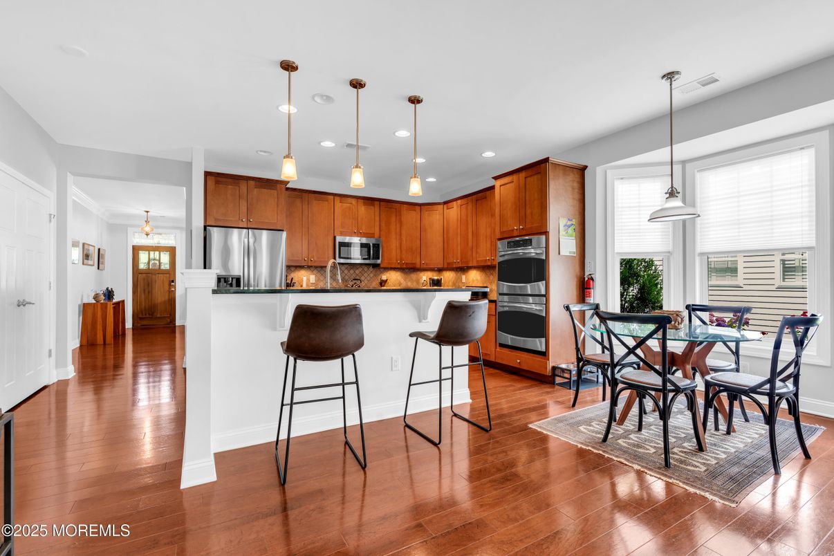 Dining room, Interior, Kitchen, Pendant Lights, Recessed Lighting, Stainless Steel Appliances, Wood Texture Flooring