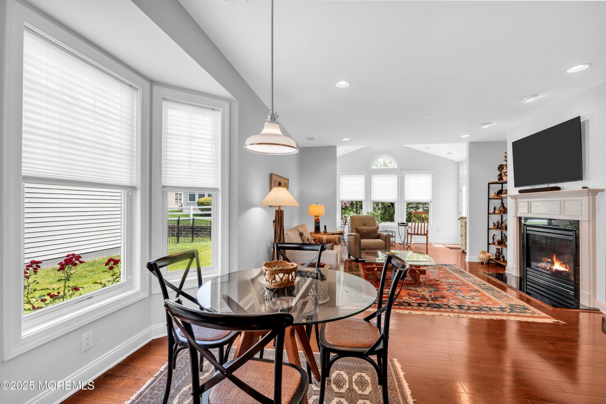 Dining room, Fireplace, Interior, Living room, Pendant Lights, Recessed Lighting, Wood Texture Flooring