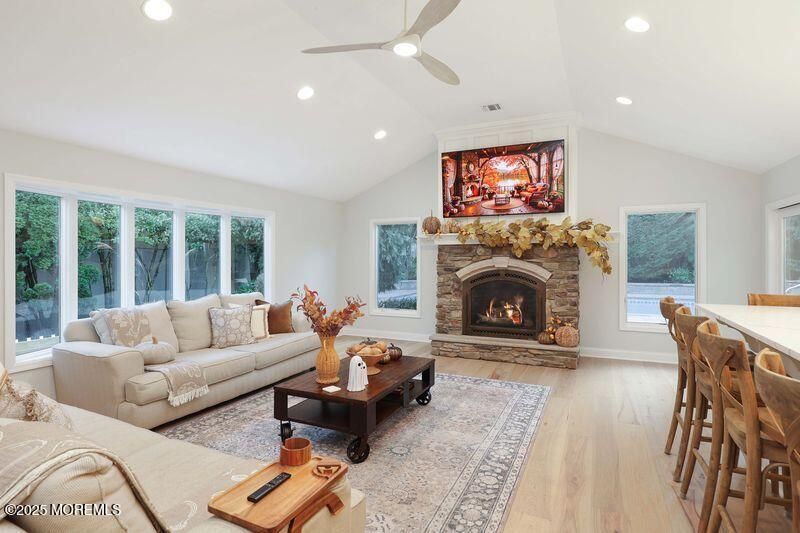 Dining room, Fireplace, Interior, Living room, Recessed Lighting, Wood Texture Flooring