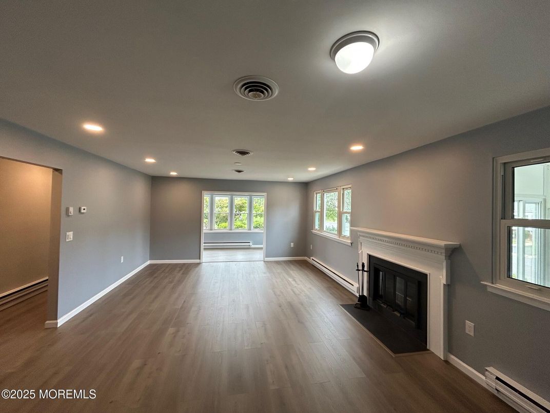 Empty room, Fireplace, Interior, Recessed Lighting, Wood Texture Flooring