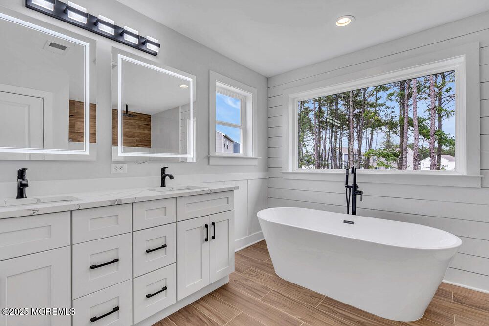 Bathroom, Dual Sink Vanities, Free Standing Baths, Interior, Recessed Lighting, Wood Texture Flooring