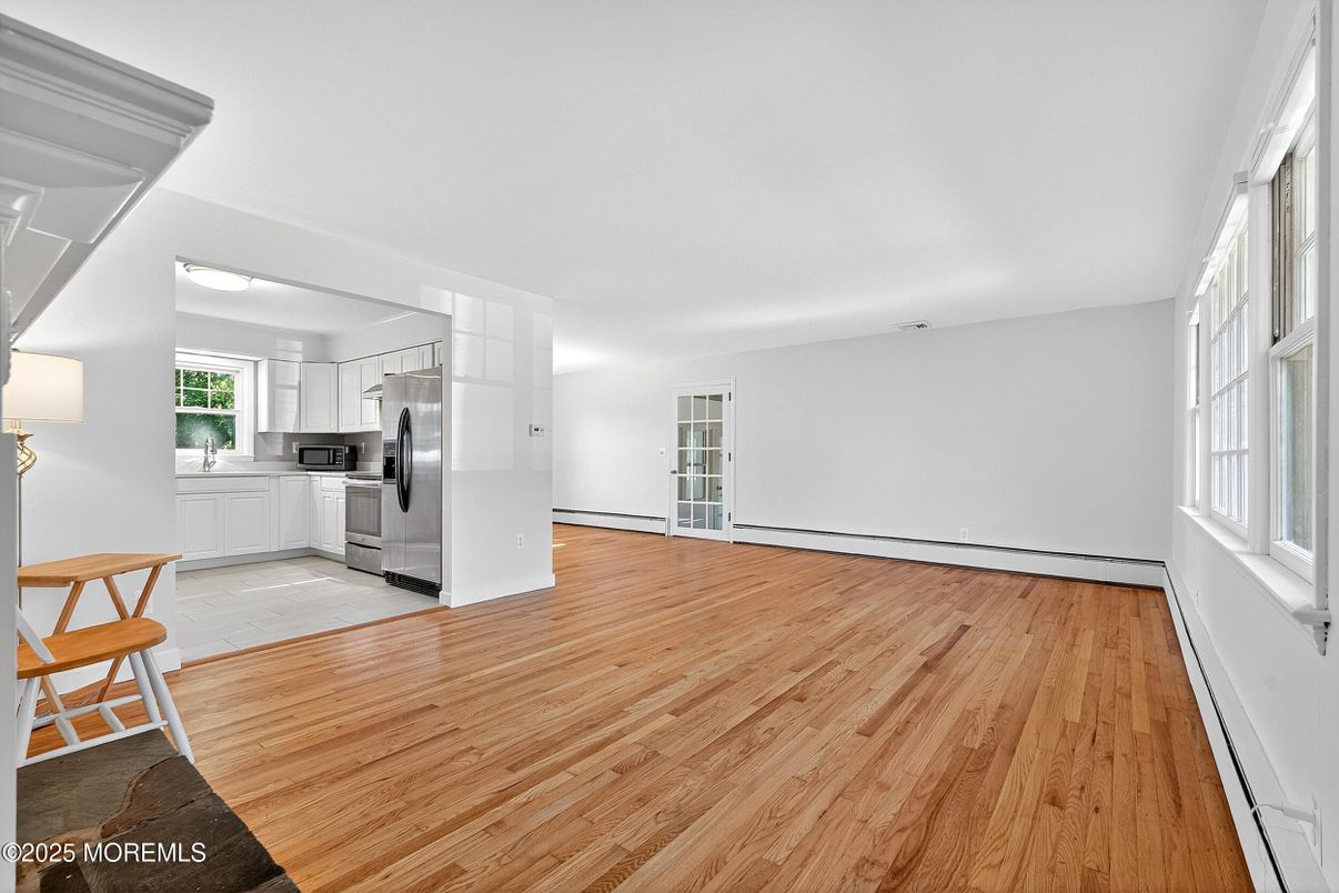 Empty room, Interior, Kitchen, Stainless Steel Appliances, Wood Texture Flooring