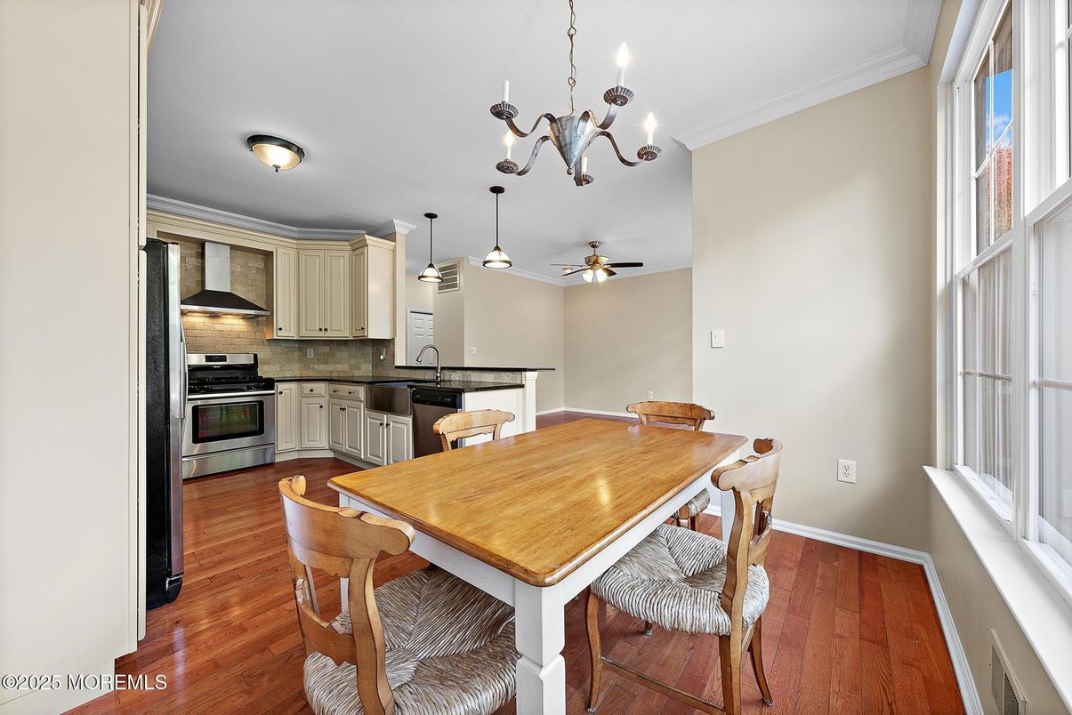 Chandelier, Dining room, Interior, Kitchen, Pendant Lights, Stainless Steel Appliances, Wood Texture Flooring