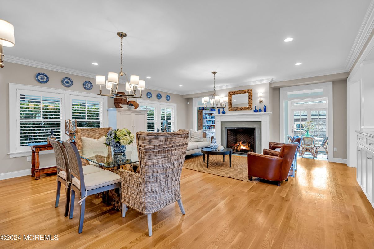 Chandelier, Dining room, Fireplace, Interior, Living room, Recessed Lighting, Wood Texture Flooring