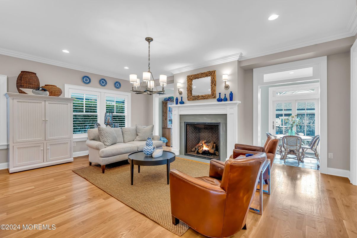 Chandelier, Fireplace, Interior, Living room, Recessed Lighting, Wood Texture Flooring