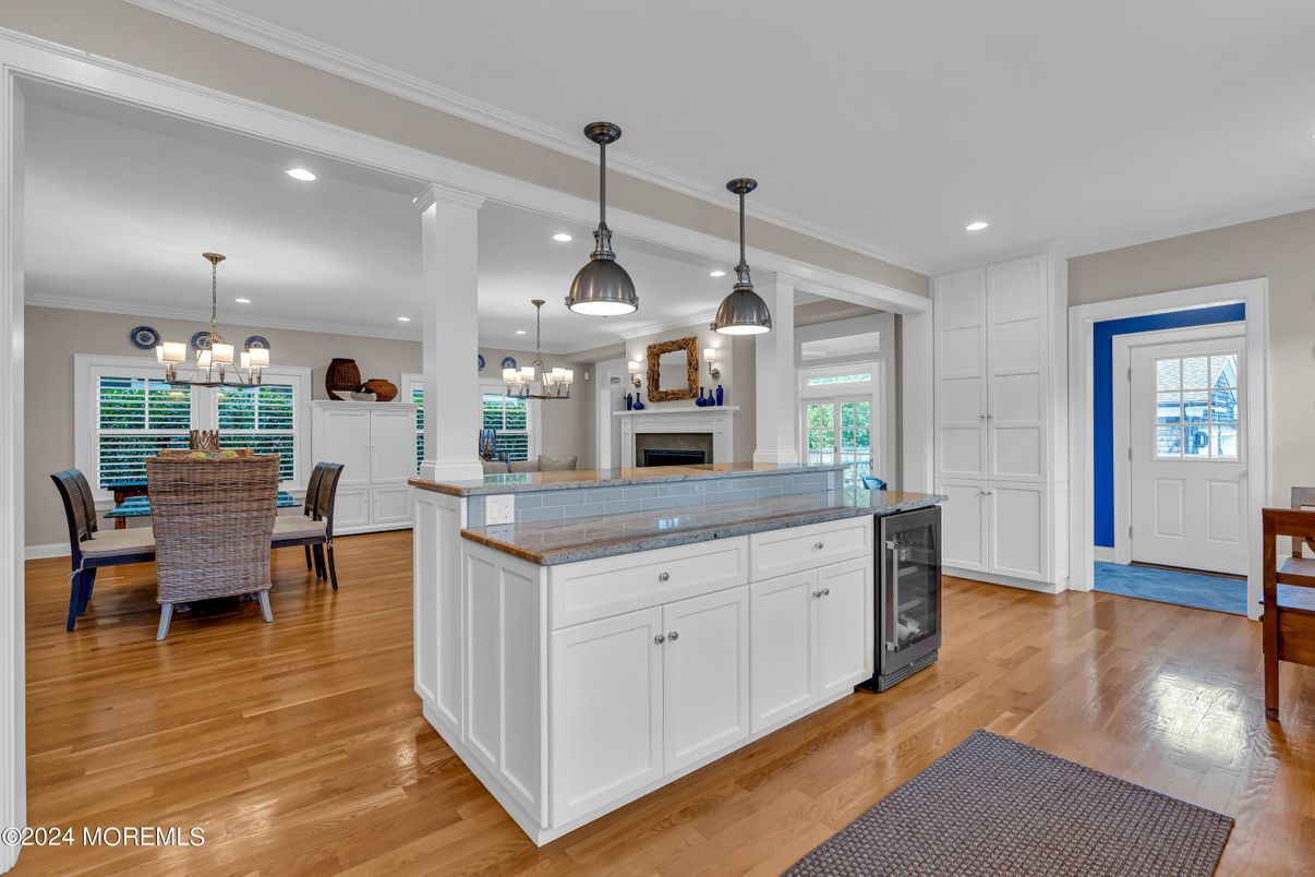Chandelier, Dining room, Fireplace, Interior, Kitchen, Pendant Lights, Recessed Lighting, Wood Texture Flooring