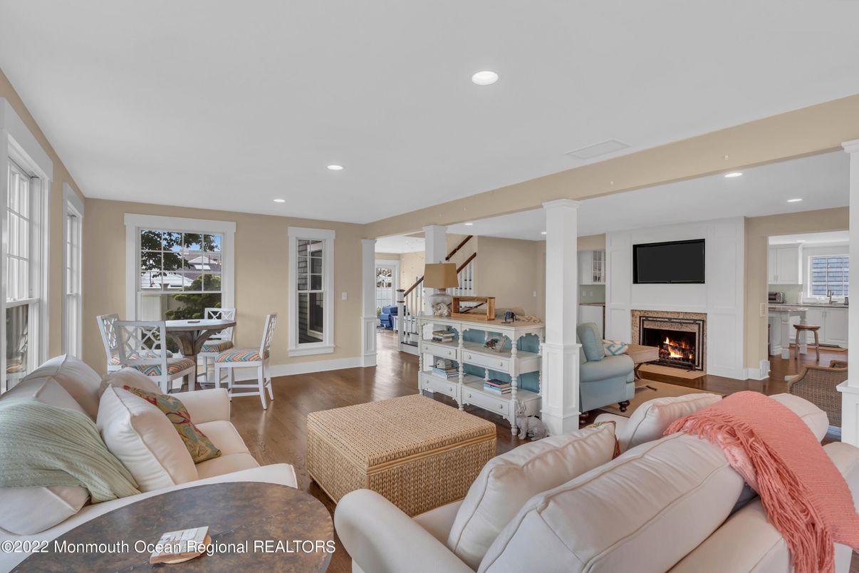 Dining room, Fireplace, Interior, Living room, Recessed Lighting, Wood Texture Flooring