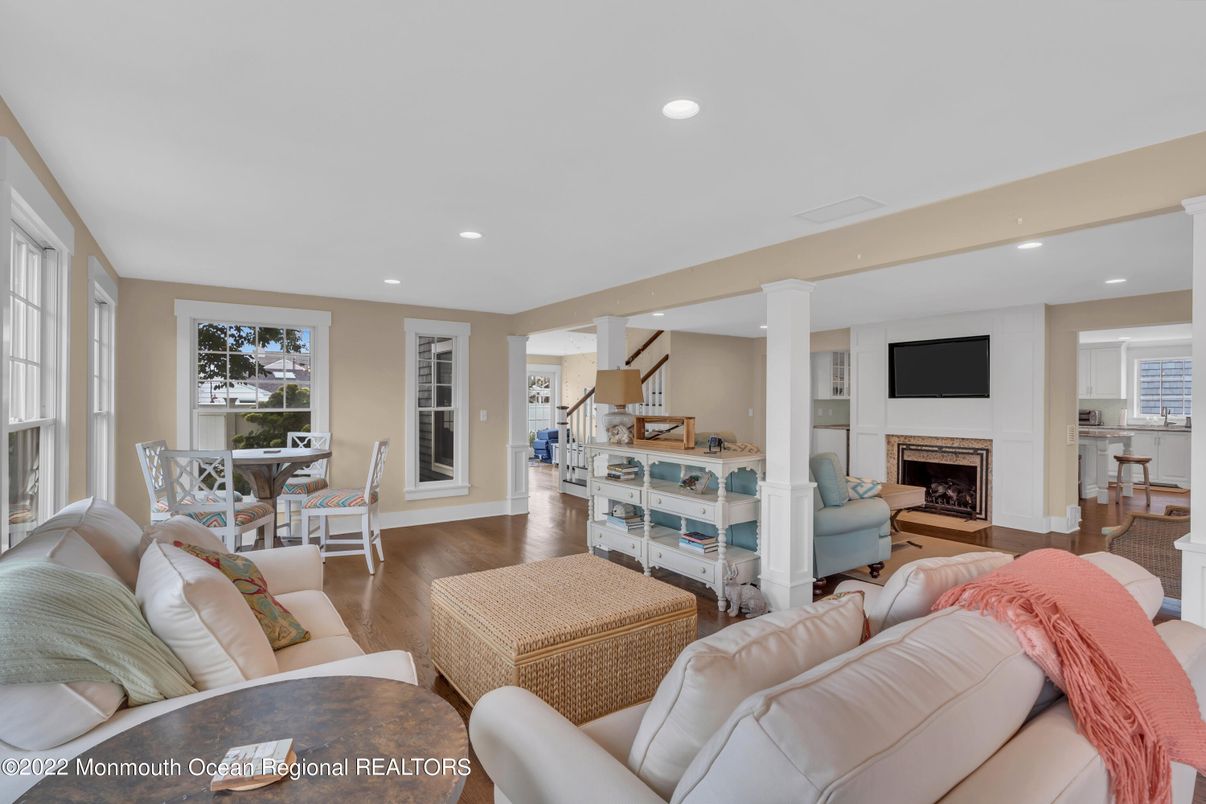 Dining room, Fireplace, Interior, Living room, Recessed Lighting, Wood Texture Flooring