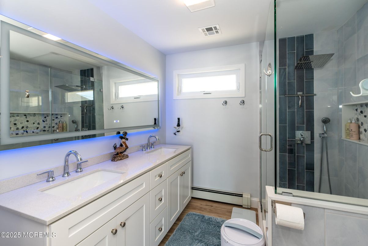 Bathroom, Dual Sink Vanities, Glass Shower, Interior, Wood Texture Flooring