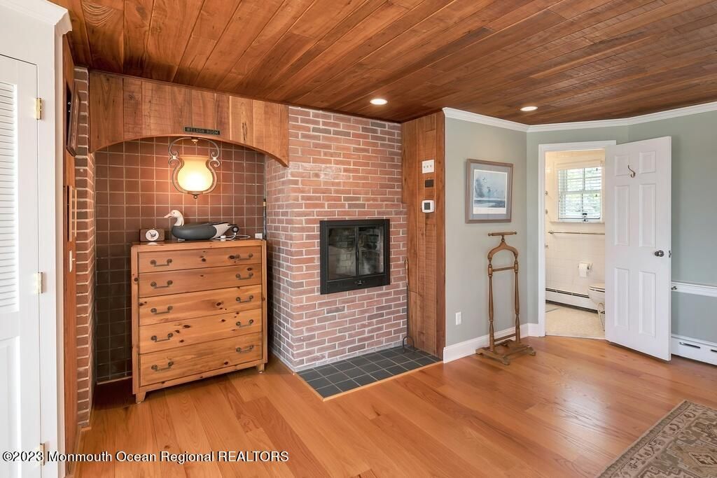 Fireplace, Interior, Recessed Lighting, Stone Walls, Wooden Ceilings, Wood Texture Flooring