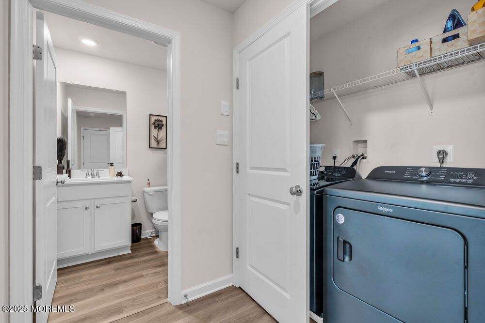 Bathroom, Interior, Recessed Lighting, Utility Closets, Washer, Wood Texture Flooring