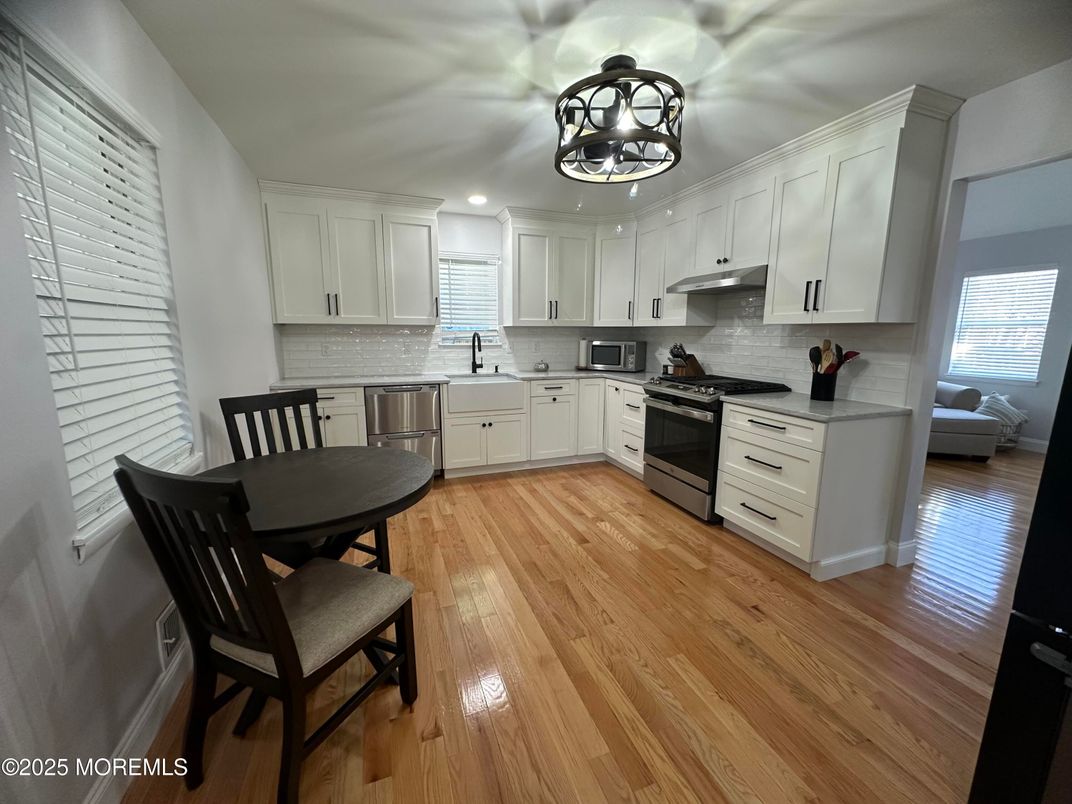 Dining room, Interior, Kitchen, Recessed Lighting, Stainless Steel Appliances, Wood Texture Flooring