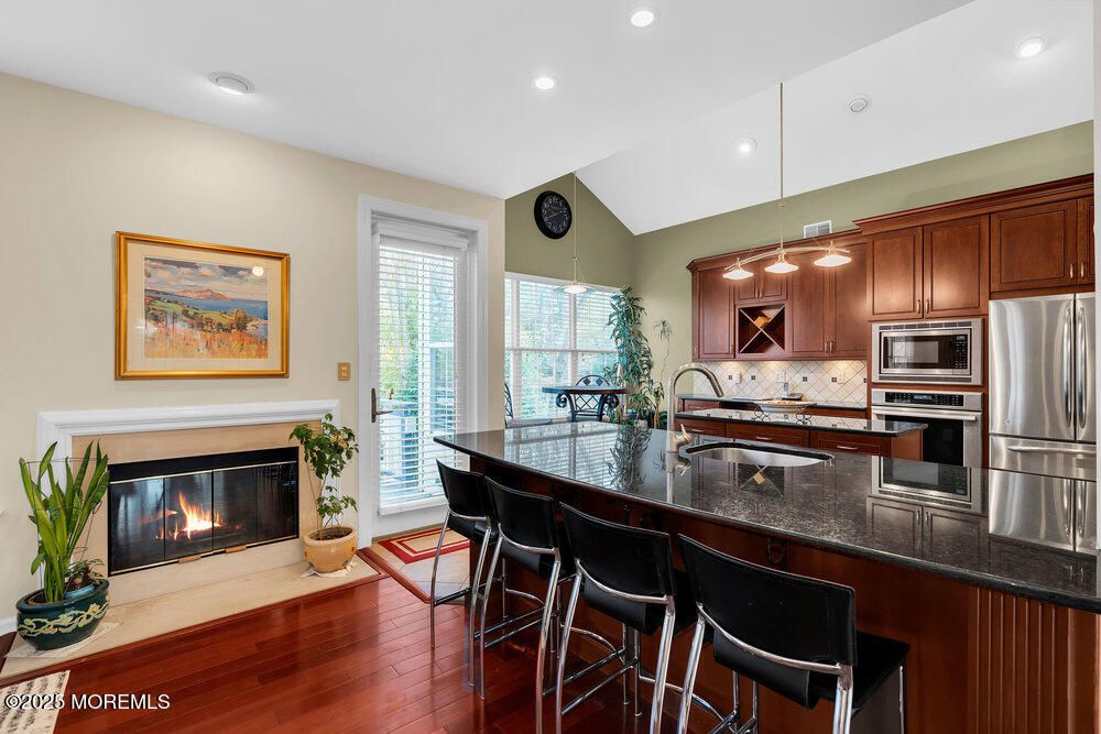 Fireplace, Interior, Kitchen, Pendant Lights, Recessed Lighting, Stainless Steel Appliances, Wood Texture Flooring