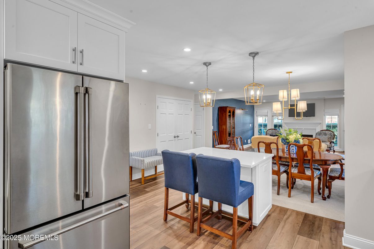 Dining room, Interior, Kitchen, Pendant Lights, Recessed Lighting, Stainless Steel Appliances, Wood Texture Flooring