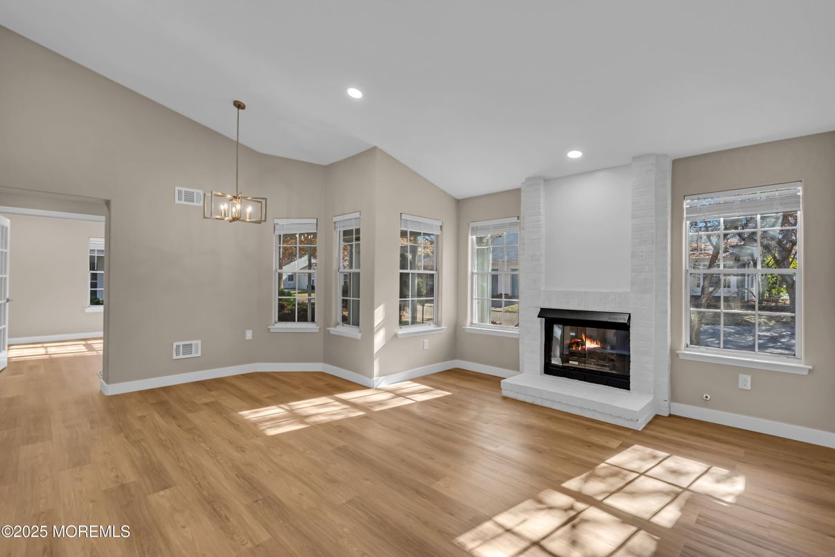 Empty room, Fireplace, Interior, Pendant Lights, Recessed Lighting, Wood Texture Flooring