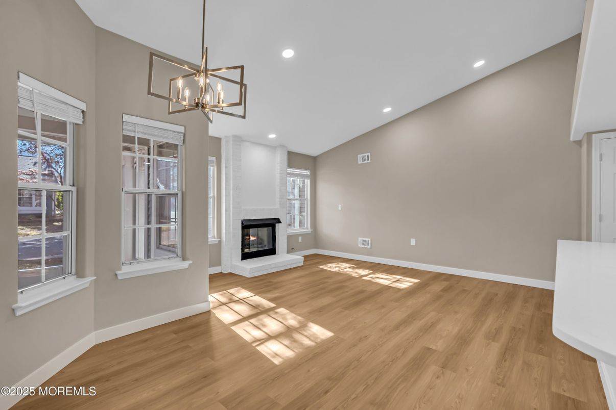 Empty room, Fireplace, Interior, Pendant Lights, Recessed Lighting, Wood Texture Flooring