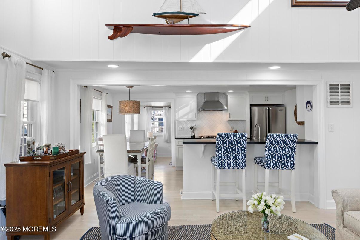 Dining room, Interior, Kitchen, Pendant Lights, Recessed Lighting, Stainless Steel Appliances, Wood Texture Flooring