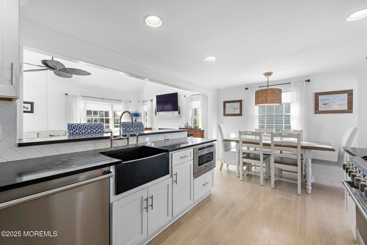 Dining room, Interior, Kitchen, Recessed Lighting, Stainless Steel Appliances, Tile Countertops, Wood Texture Flooring