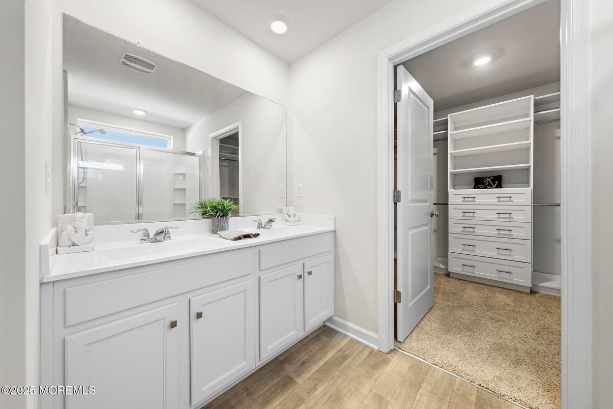 Bathroom, Dual Sink Vanities, Interior, Recessed Lighting, Walk-in Closets, Wood Texture Flooring