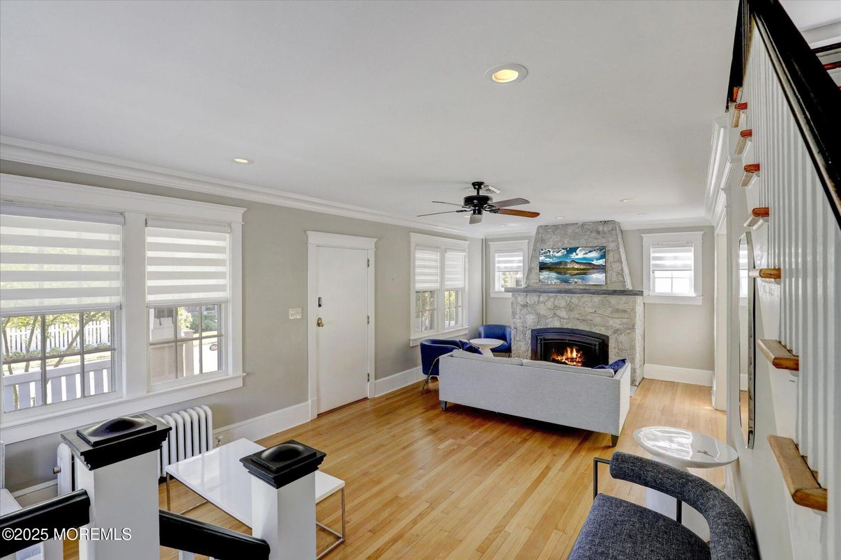 Fireplace, Interior, Living room, Recessed Lighting, Stone Walls, Wood Texture Flooring