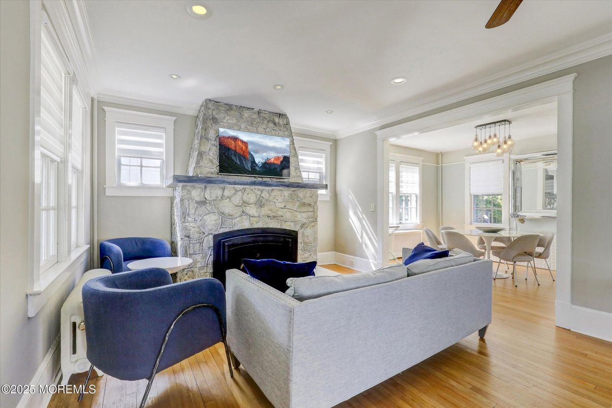 Chandelier, Dining room, Fireplace, Interior, Living room, Recessed Lighting, Stone Walls, Wood Texture Flooring