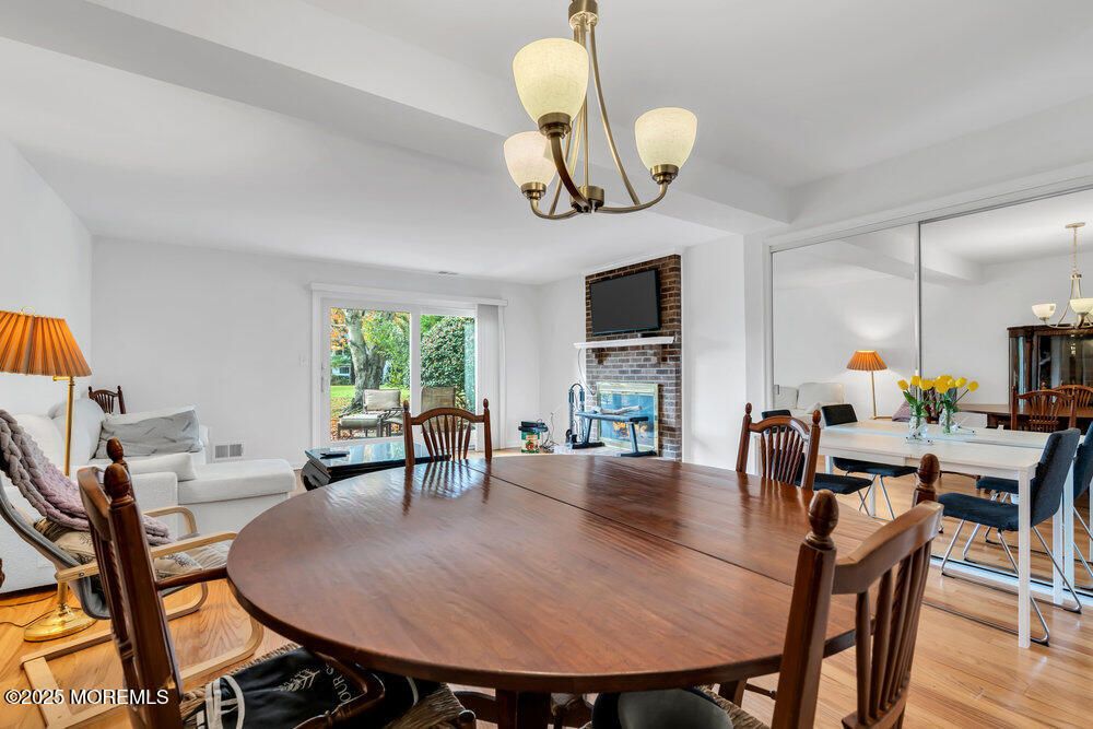 Chandelier, Dining room, Fireplace, Interior, Wood Texture Flooring