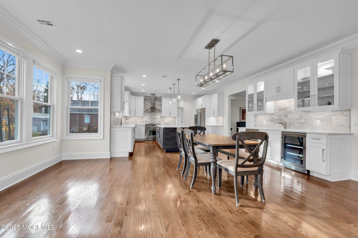 Chandelier, Dining room, Interior, Kitchen, Pendant Lights, Recessed Lighting, Stainless Steel Appliances, Wood Texture Flooring