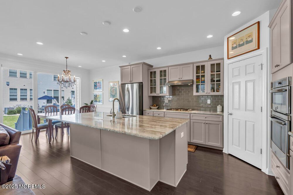 Chandelier, Dining room, Interior, Kitchen, Recessed Lighting, Stainless Steel Appliances, Wood Texture Flooring