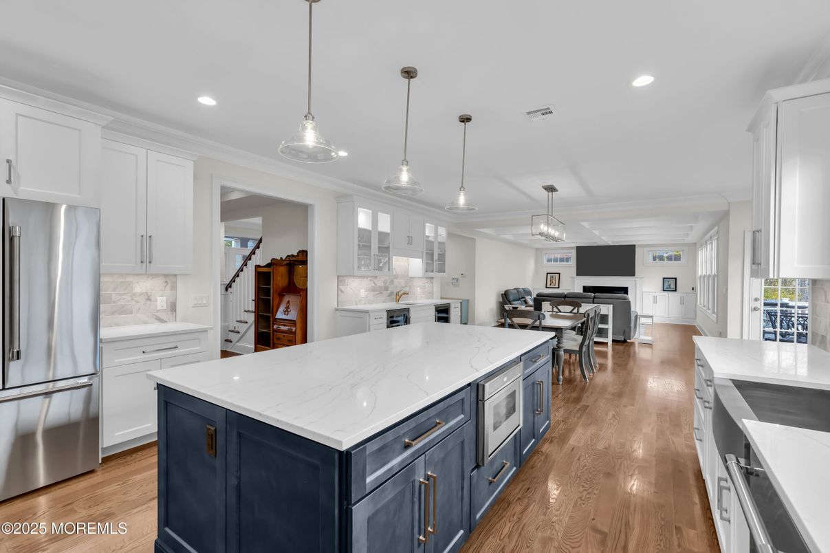 Dining room, Interior, Kitchen, Pendant Lights, Recessed Lighting, Stainless Steel Appliances, Wood Texture Flooring
