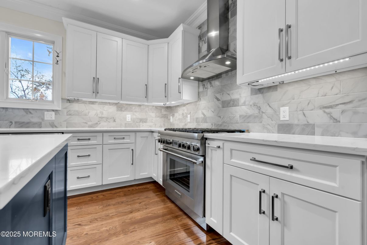 Interior, Kitchen, Marble Walls, Recessed Lighting, Stainless Steel Appliances, Wood Texture Flooring