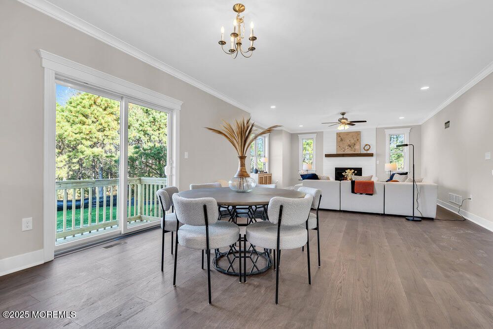 Chandelier, Dining room, Fireplace, Interior, Living room, Recessed Lighting, Wood Texture Flooring