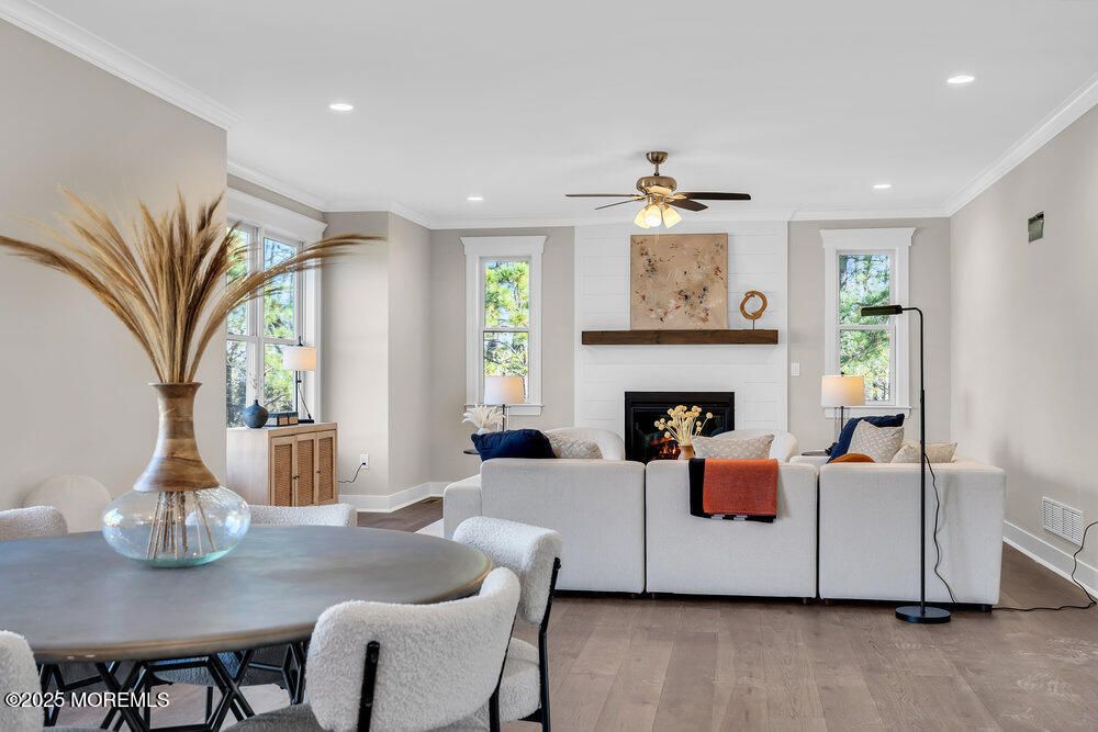 Dining room, Fireplace, Interior, Living room, Recessed Lighting, Stone Walls, Wood Texture Flooring