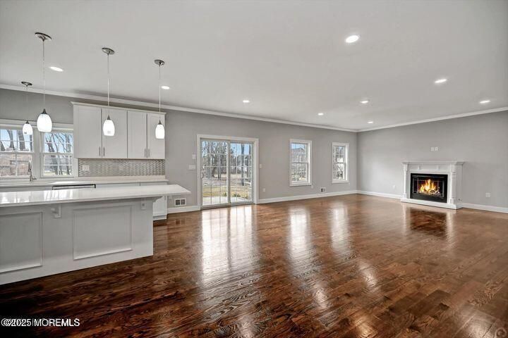 Empty room, Fireplace, Interior, Kitchen, Pendant Lights, Recessed Lighting, Wood Texture Flooring