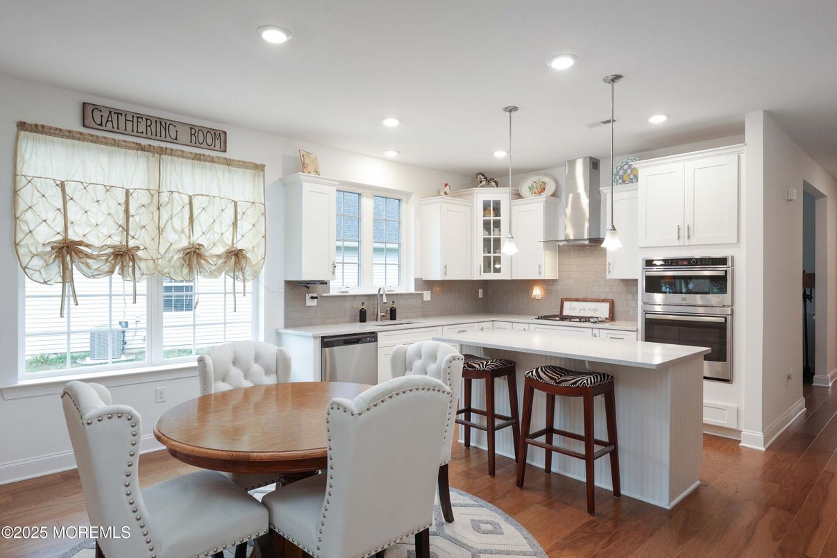 Dining room, Interior, Kitchen, Pendant Lights, Recessed Lighting, Stainless Steel Appliances, Wood Texture Flooring