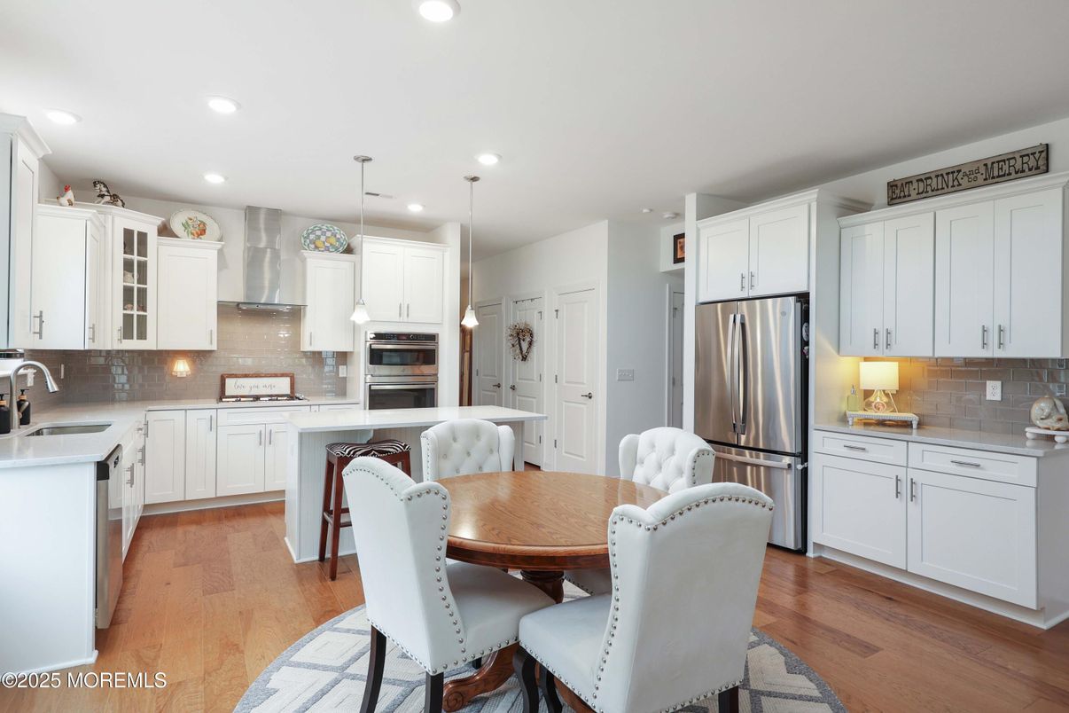 Dining room, Interior, Kitchen, Pendant Lights, Recessed Lighting, Stainless Steel Appliances, Wood Texture Flooring