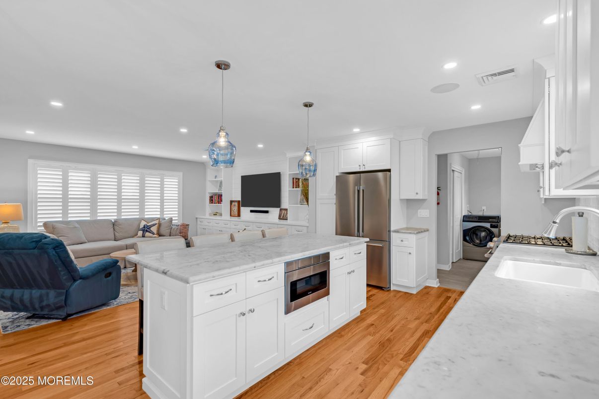 Interior, Kitchen, Living room, Pendant Lights, Recessed Lighting, Stainless Steel Appliances, Washer, Wood Texture Flooring