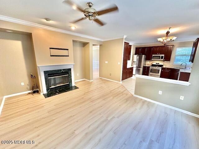Chandelier, Empty room, Fireplace, Interior, Kitchen, Stainless Steel Appliances, Wood Texture Flooring