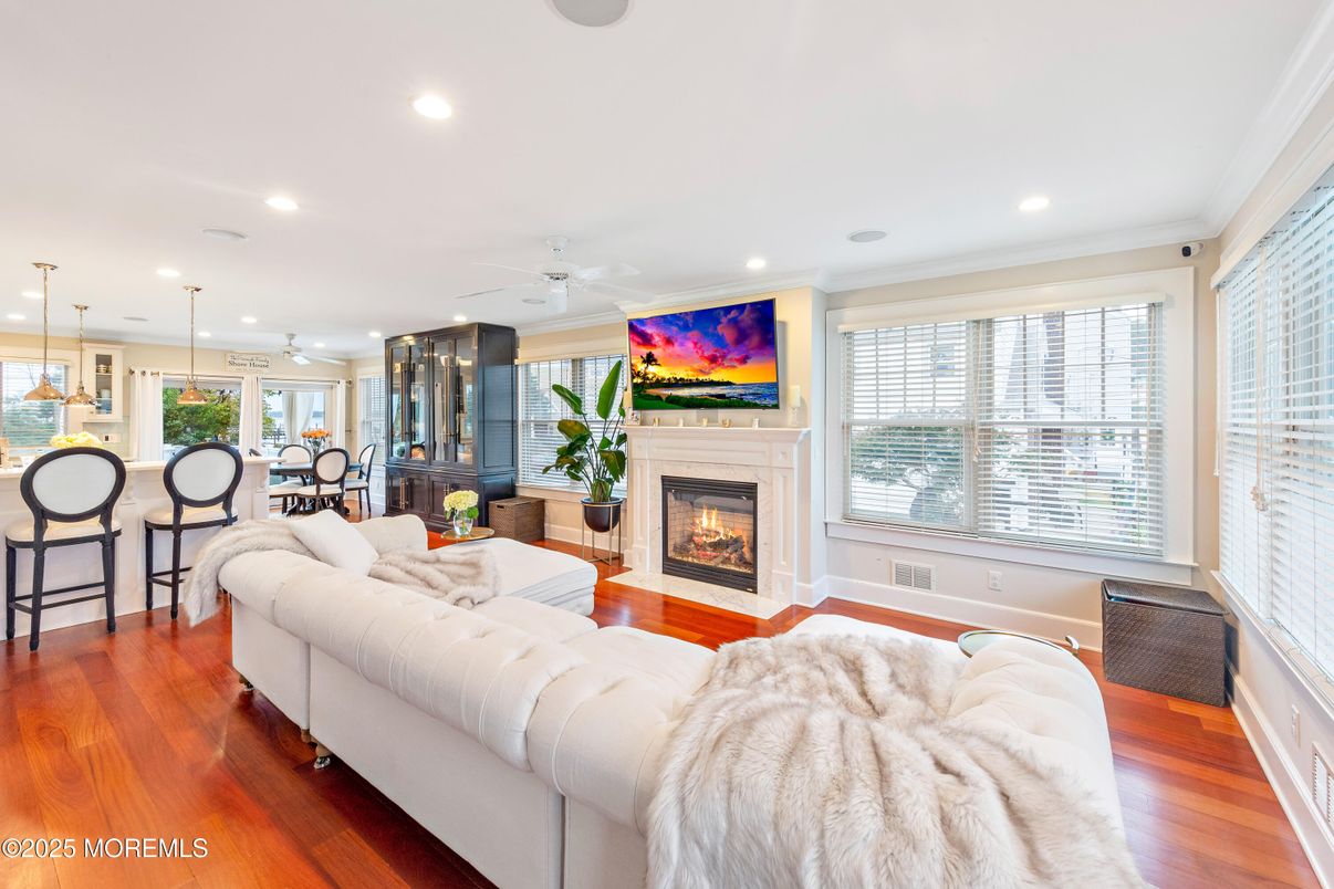 Dining room, Fireplace, Interior, Living room, Pendant Lights, Recessed Lighting, Wood Texture Flooring