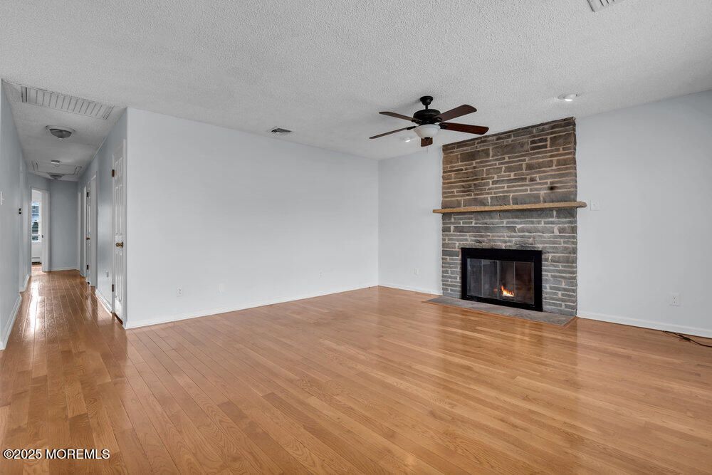 Empty room, Fireplace, Interior, Stone Walls, Wood Texture Flooring
