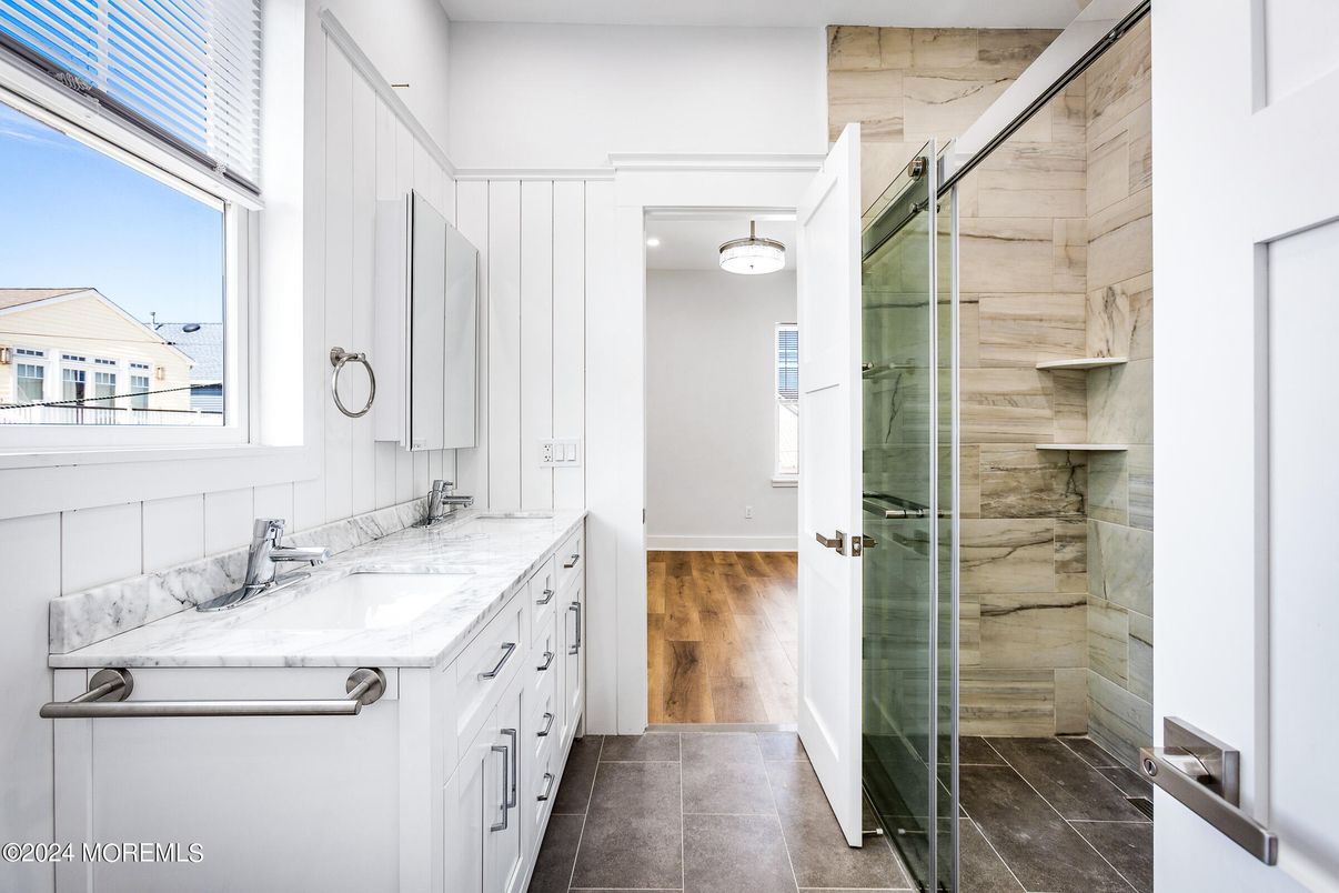Bathroom, Dual Sink Vanities, Glass Shower, Interior, Wood Texture Flooring