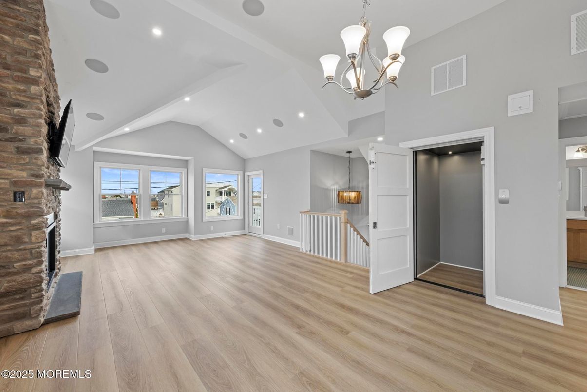 Chandelier, Empty room, Fireplace, Interior, Pendant Lights, Recessed Lighting, Wood Texture Flooring