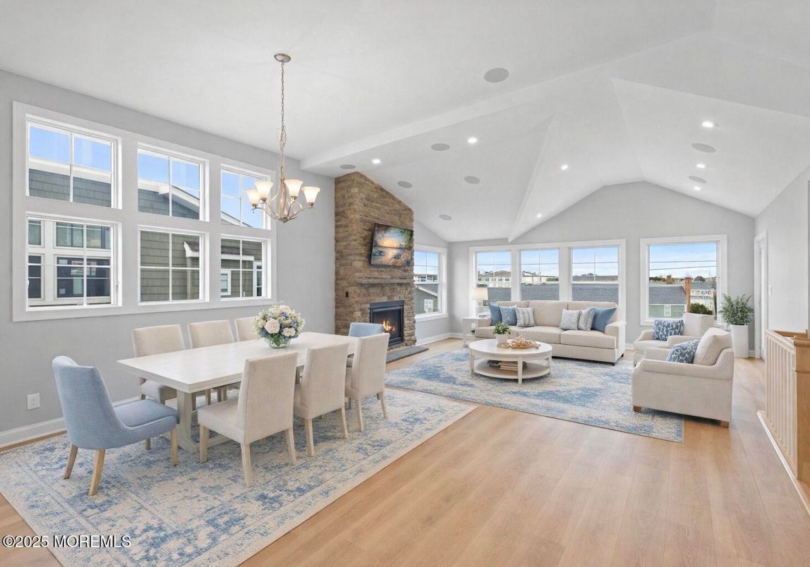 Chandelier, Dining room, Fireplace, Interior, Living room, Recessed Lighting, Stone Walls, Wood Texture Flooring