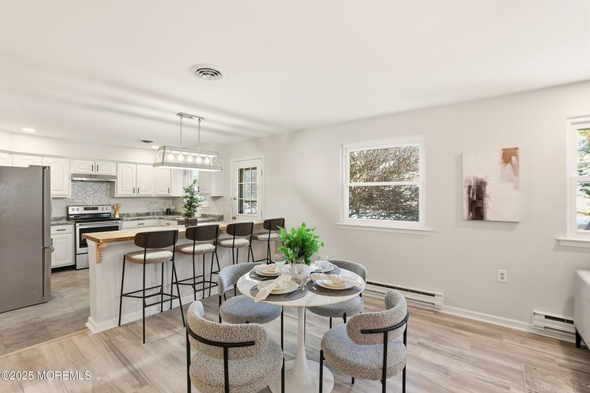 Dining room, Interior, Kitchen, Pendant Lights, Recessed Lighting, Stainless Steel Appliances, Wood Texture Flooring