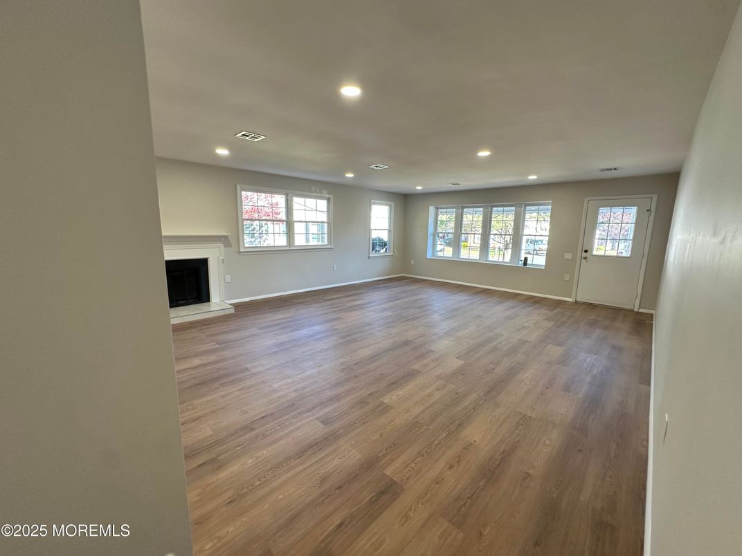 Empty room, Fireplace, Interior, Recessed Lighting, Wood Texture Flooring