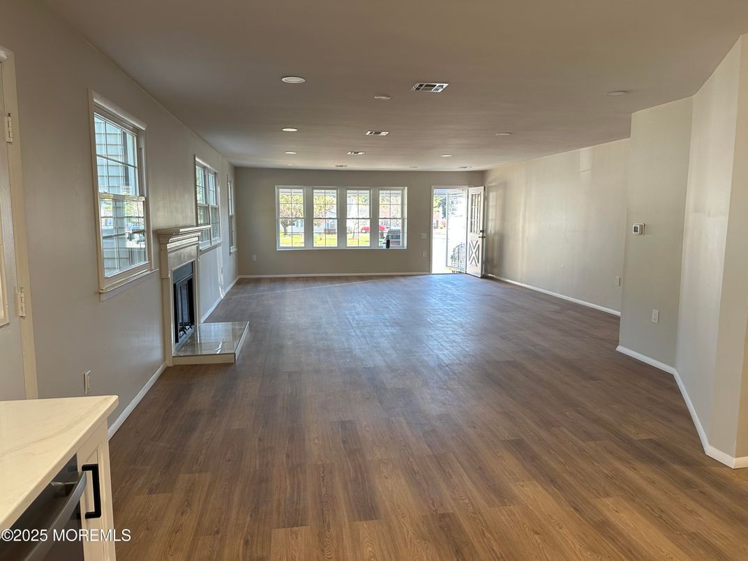 Empty room, Fireplace, Interior, Recessed Lighting, Wood Texture Flooring