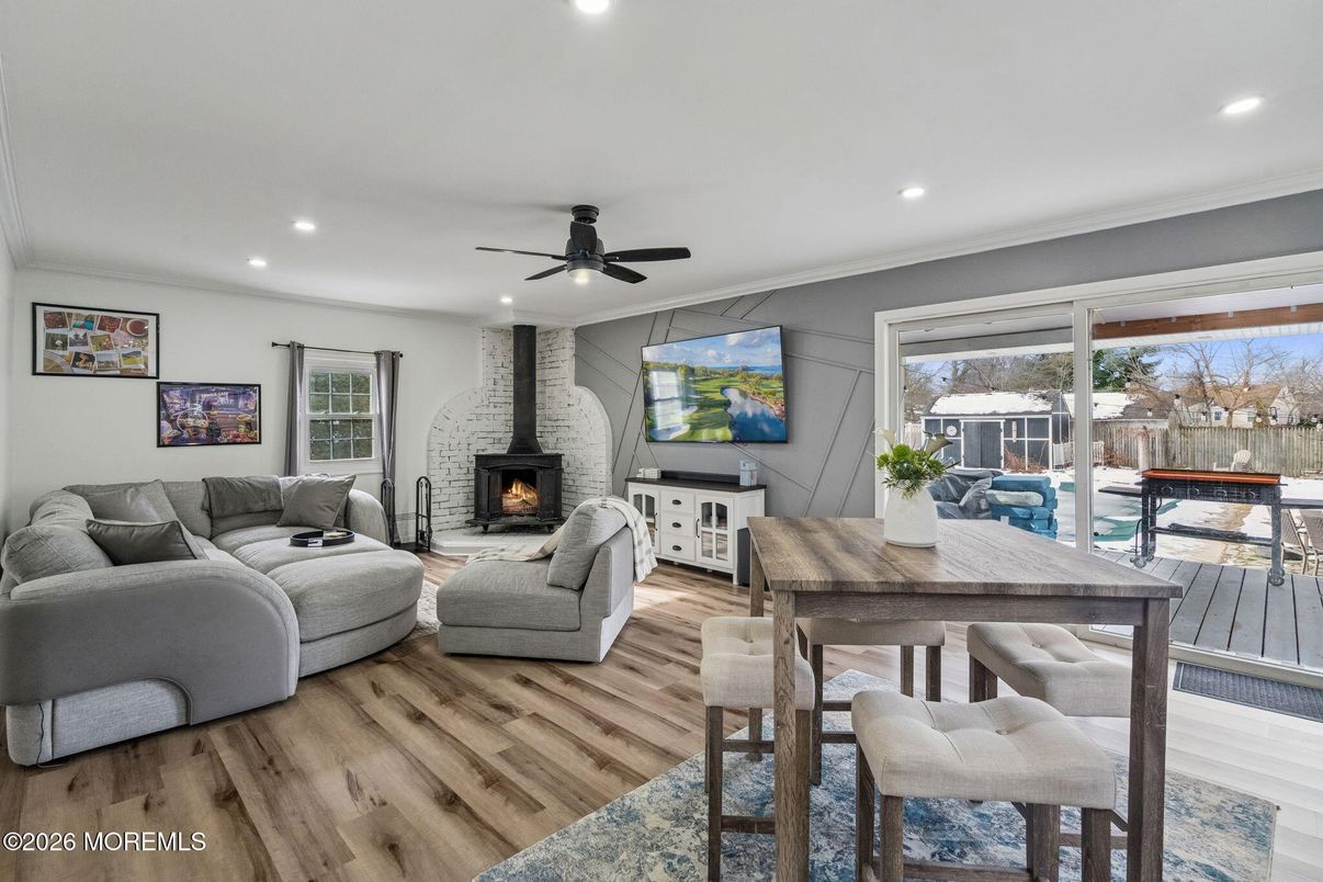 Dining room, Fireplace, Interior, Living room, Recessed Lighting, Wood Texture Flooring