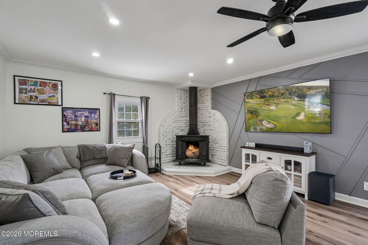 Fireplace, Interior, Living room, Recessed Lighting, Stone Walls, Wood Texture Flooring