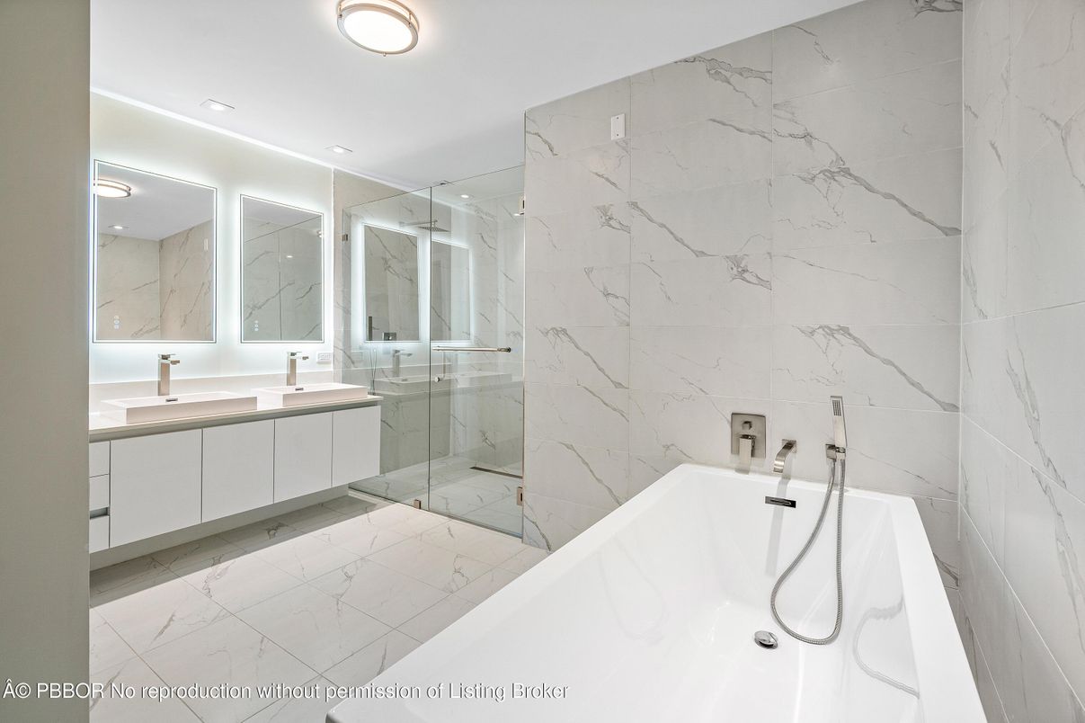 Bathroom, Dual Sink Vanities, Glass Shower, Interior, Marble, Marble Walls, Recessed Lighting